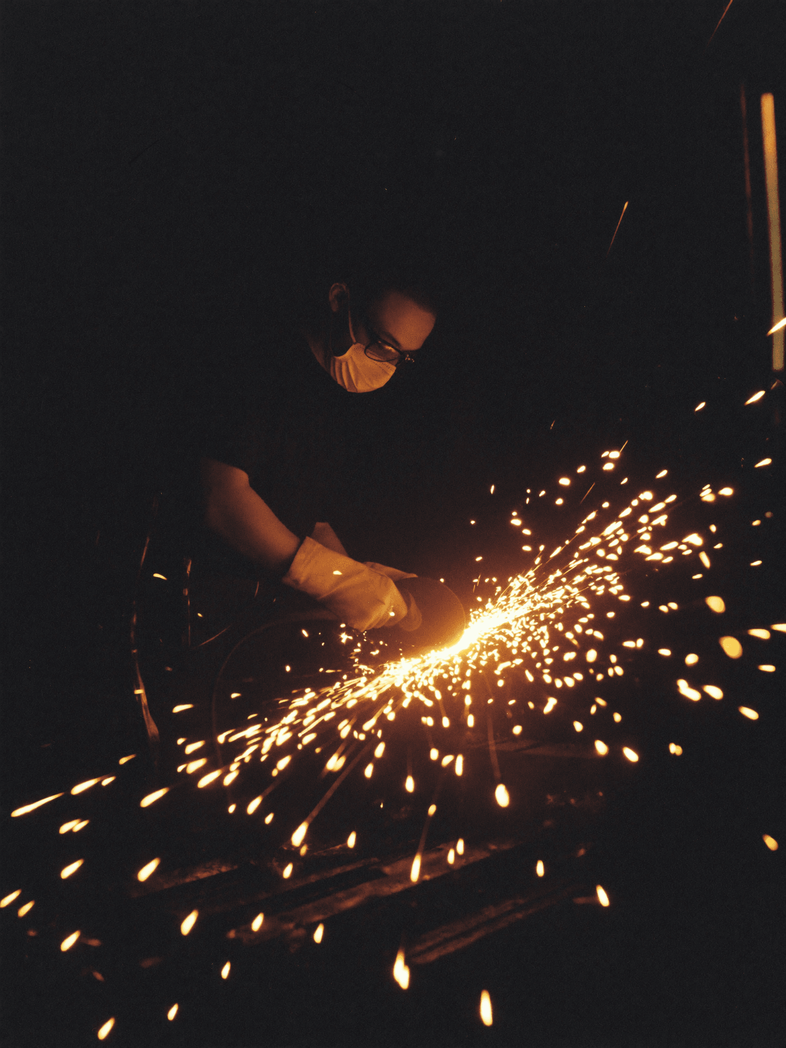 Grinding metal, sparks flying